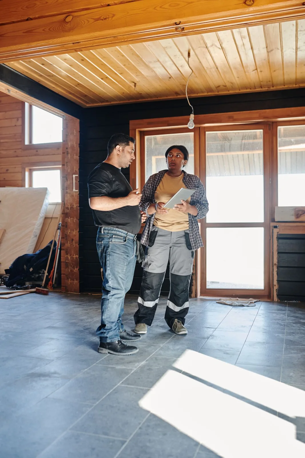 Licensed stock photograph of two people discussing renovation plans