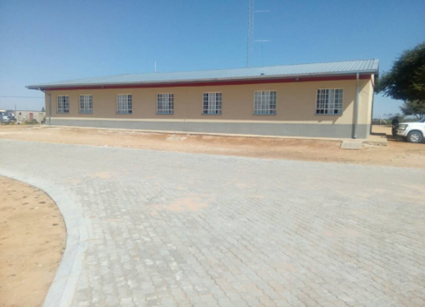 Building exterior with a paved foreground